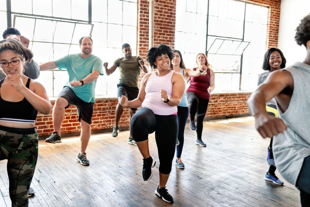 A group of men and women dancing 