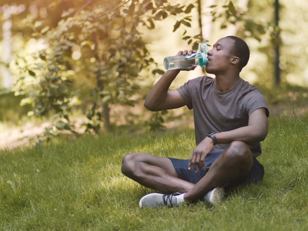 Man Staying Hydrated with Help From Family Pharmacy