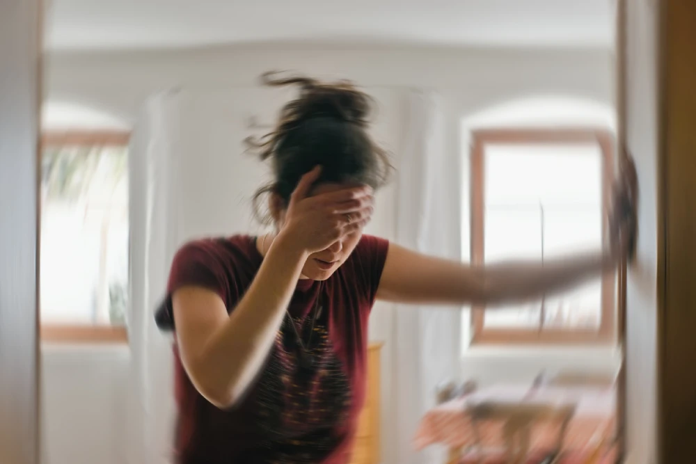 woman experiencing a migraine symptoms - needing migraine relief