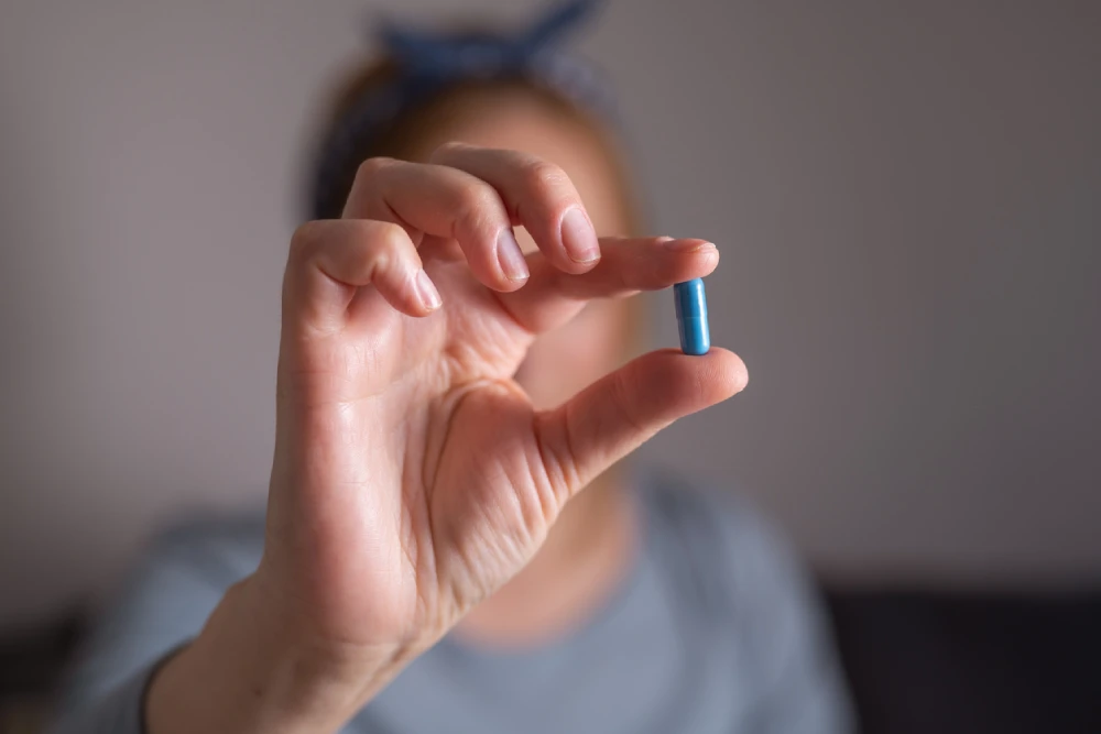person holding HIV medication