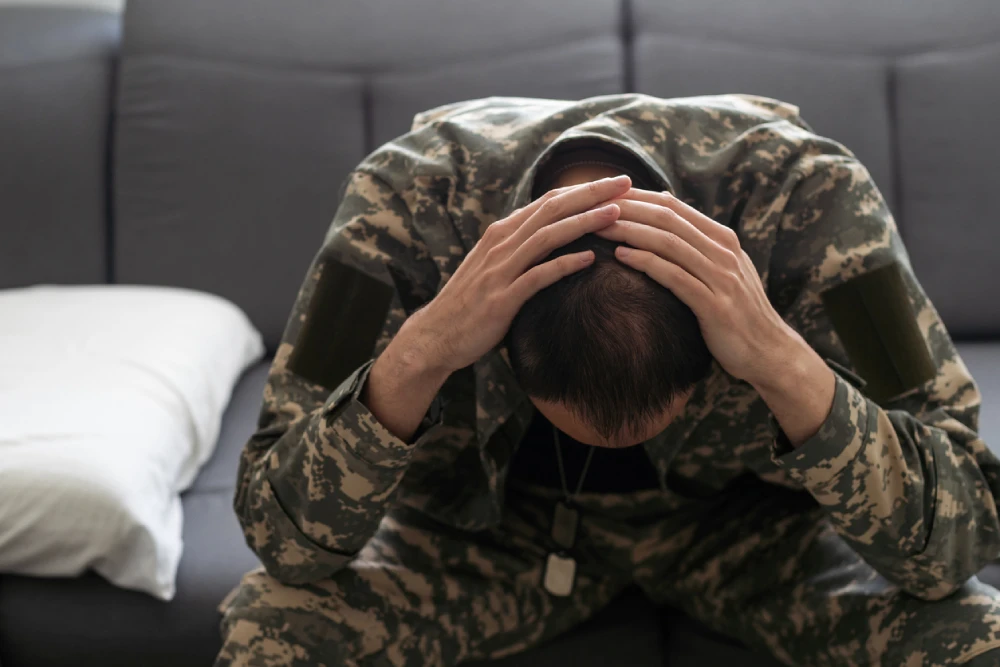 military person experiencing PTSD symptoms