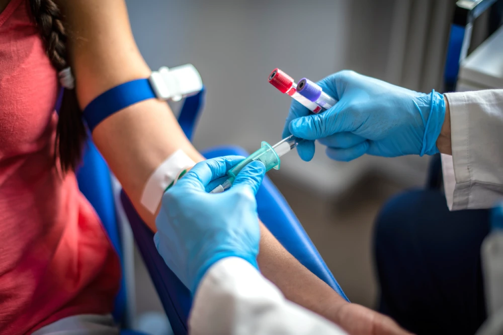 a woman getting blood taken for a hepatitis test
