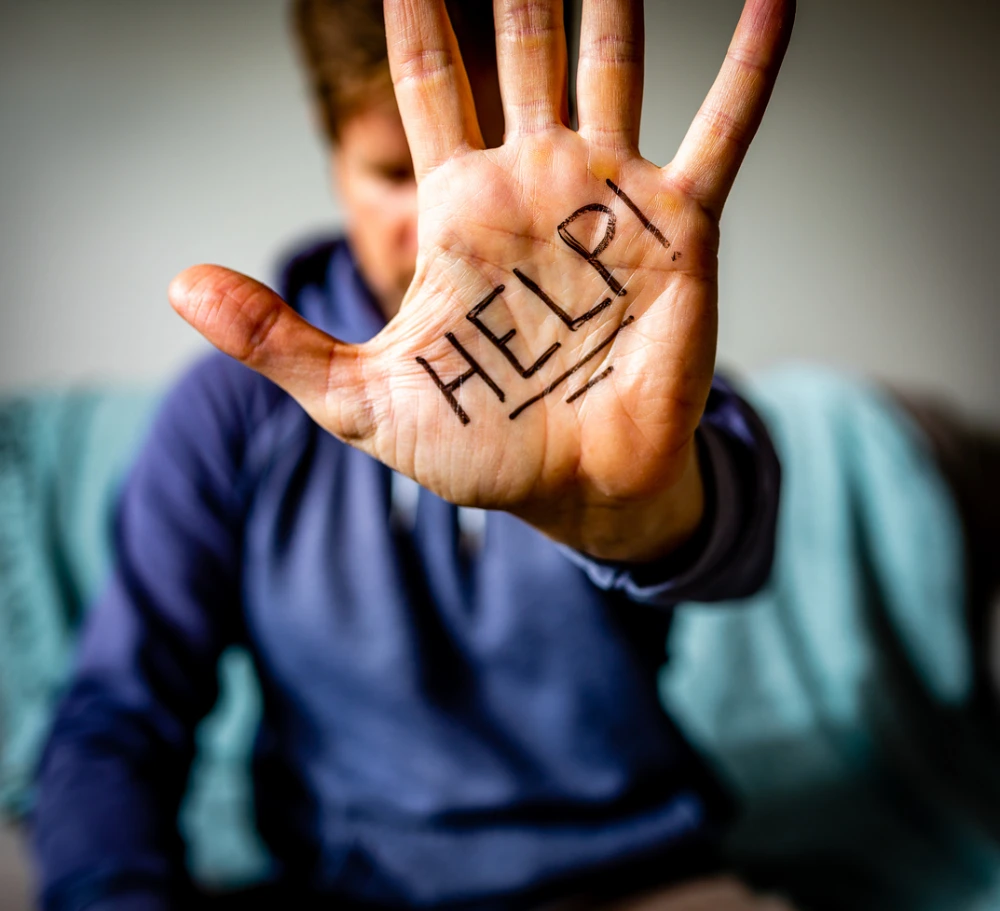 overdose prevention - man with "help" written on his hand