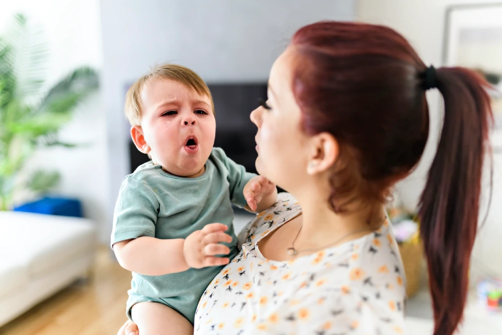 baby showing RSV symptoms - coughing and congestion