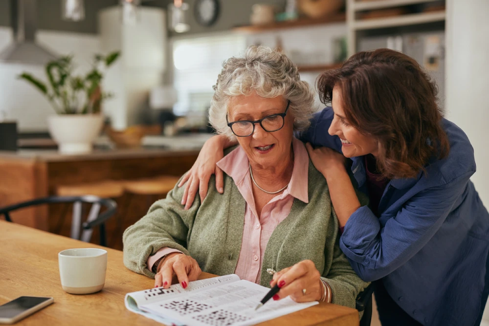 mother and daughter doing a crossword to support women's brain health