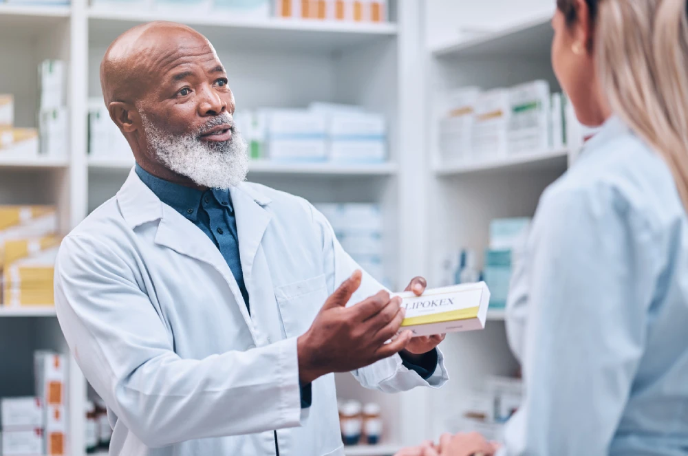 pharmacist explaining a medication to a patient