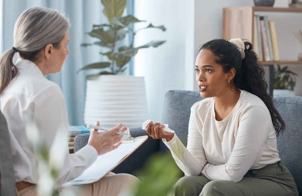 young woman talking to a therapist